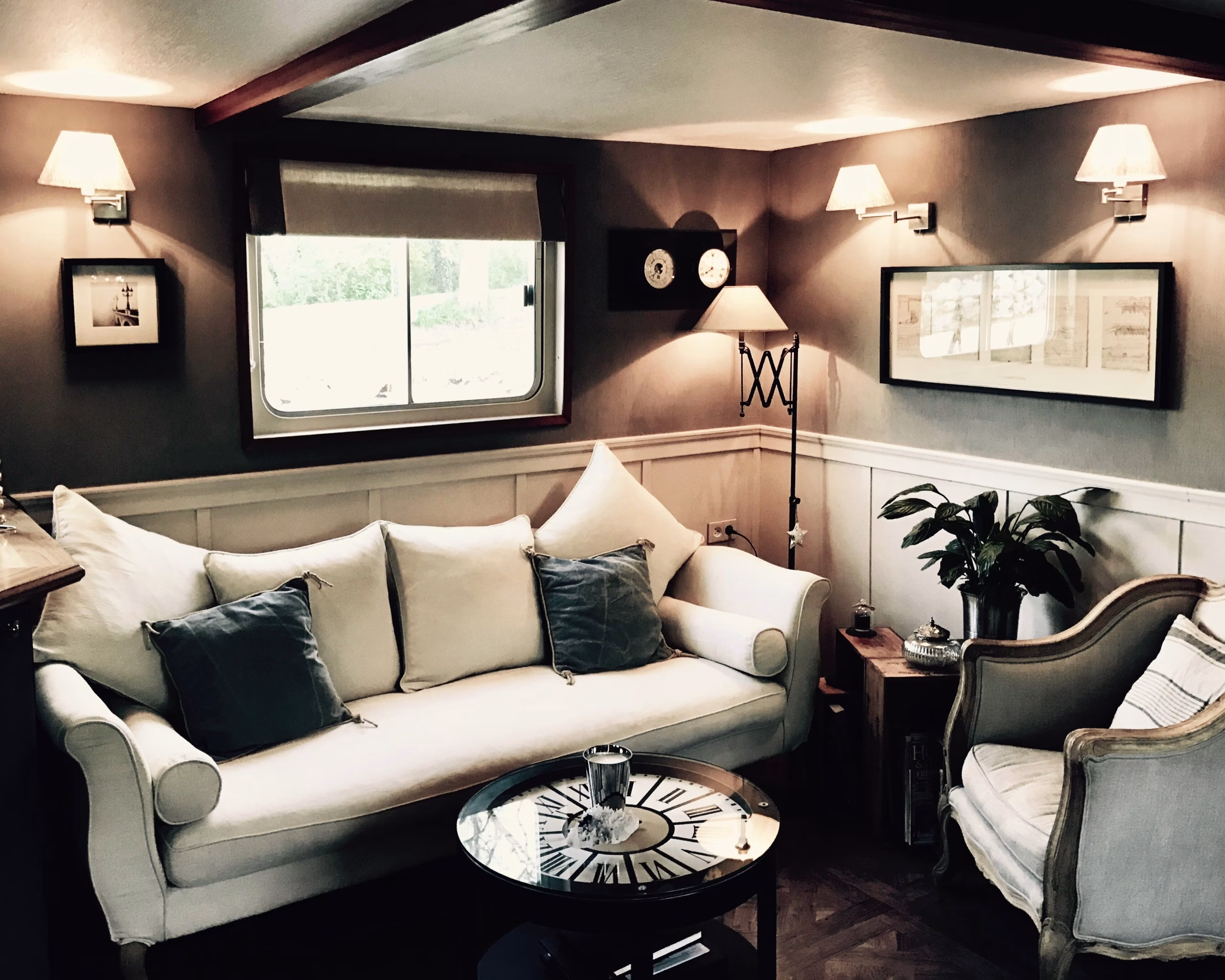 This Bordeaux Barge Cruise Includes Château d’Yquem and a Michelin-Starred Lunch 3 Elegant interior salon of the Saint Louis hotel barge with warm lighting and comfortable seating