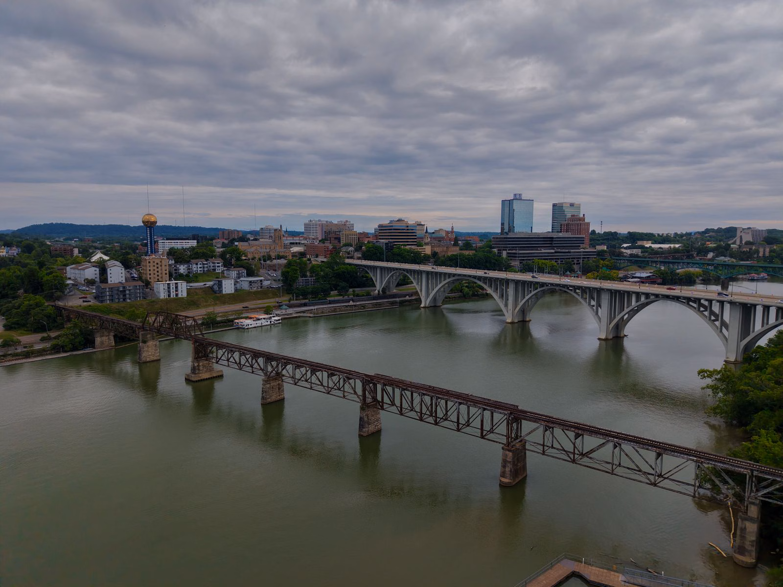Where to Stay in Knoxville, TN (and the Airport Airbnb I'd Book Again) 2 Aerial view of bridges crossing the Tennessee River toward the downtown Knoxville skyline and the Sunsphere