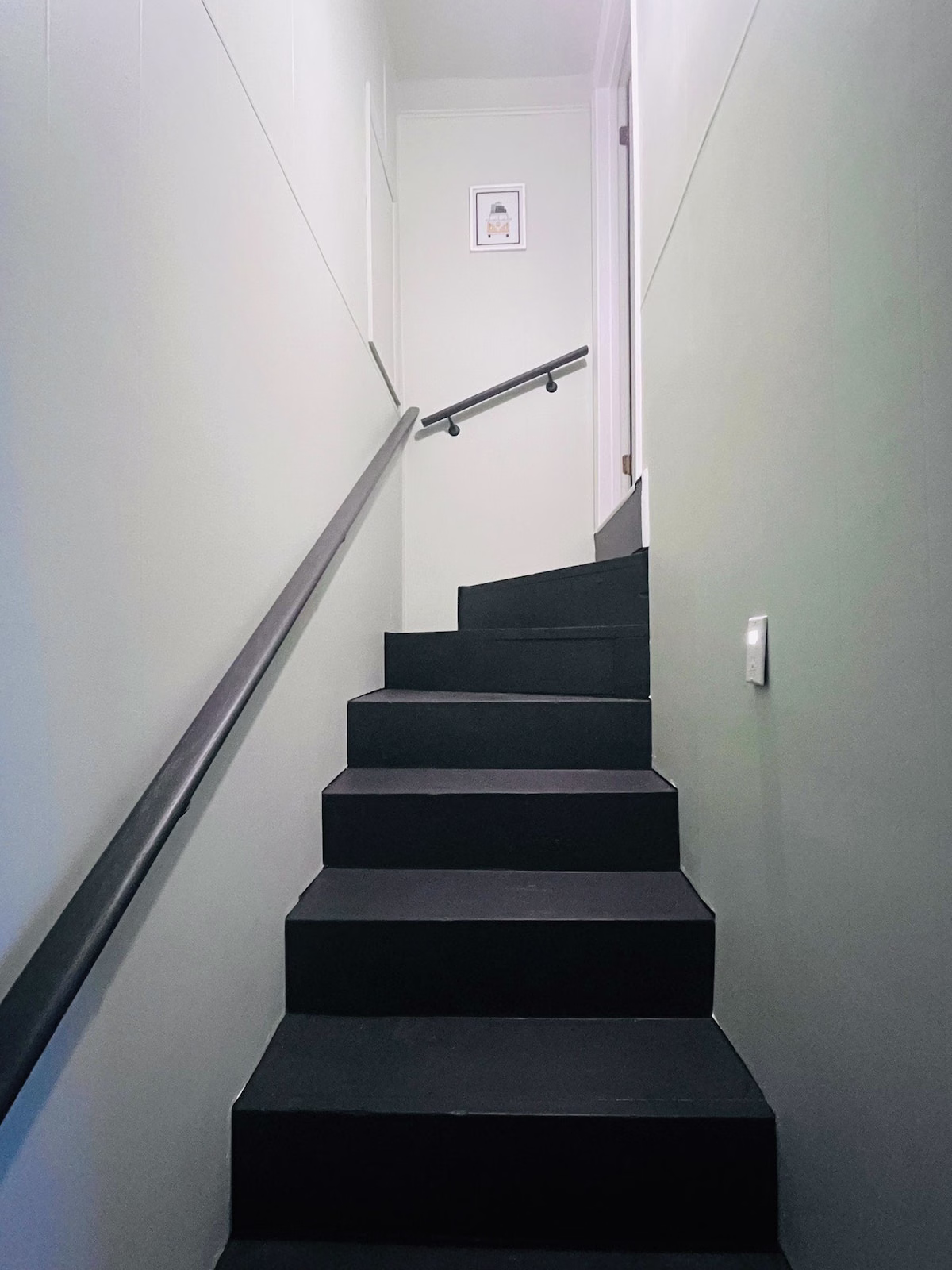 Where to Stay in Knoxville, TN (and the Airport Airbnb I'd Book Again) 9 A narrow carpeted staircase with a wall handrail leading up to the loft bedroom and bathroom